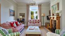 A blend of vintage flair and modern touches create this unique and welcoming sitting-room.
