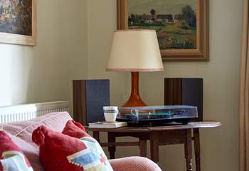 Vintage vibes and natural light create a perfect spot for relaxing entertainment. 