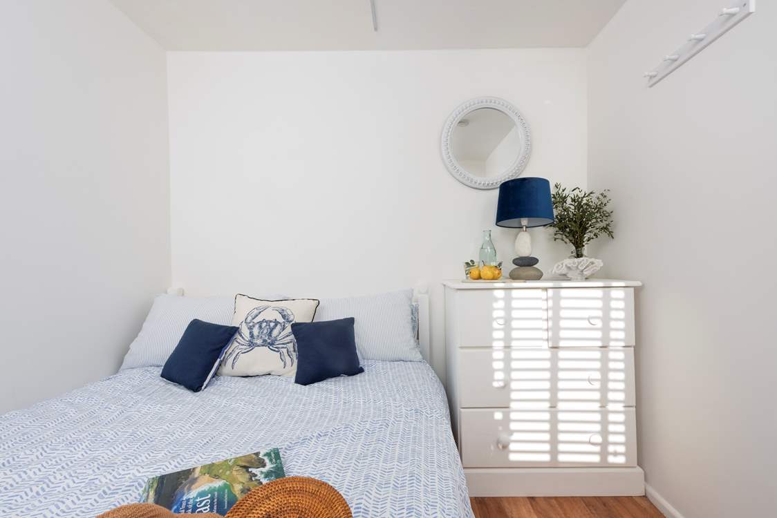 A double bed awaits in bedroom 1.