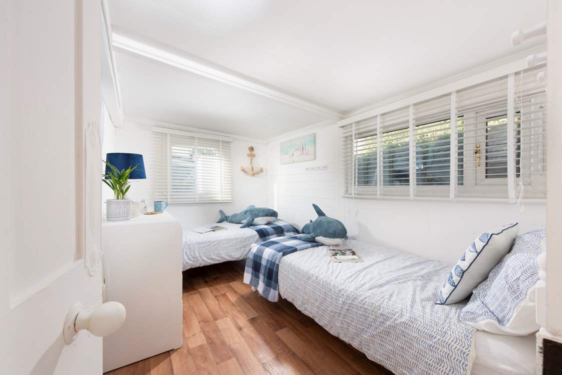 Twin beds are the order of the day in the second bedroom.