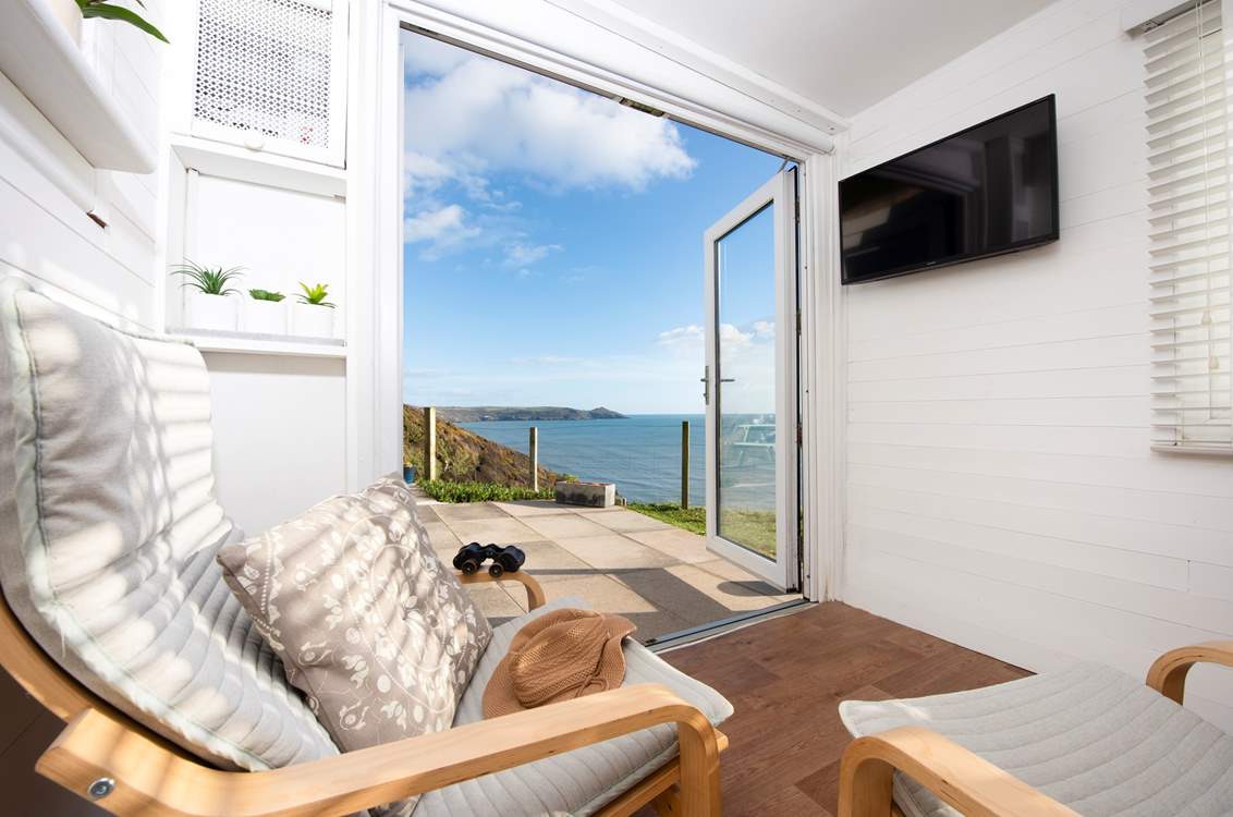 Fling open the doors and soak in that view (a folding dining-table and chairs has since been added).