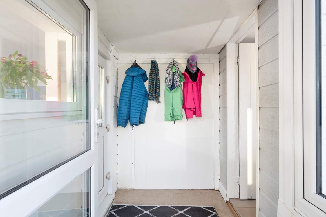 Plenty of room in the entrance hall for coats, boots and surfing gear.
