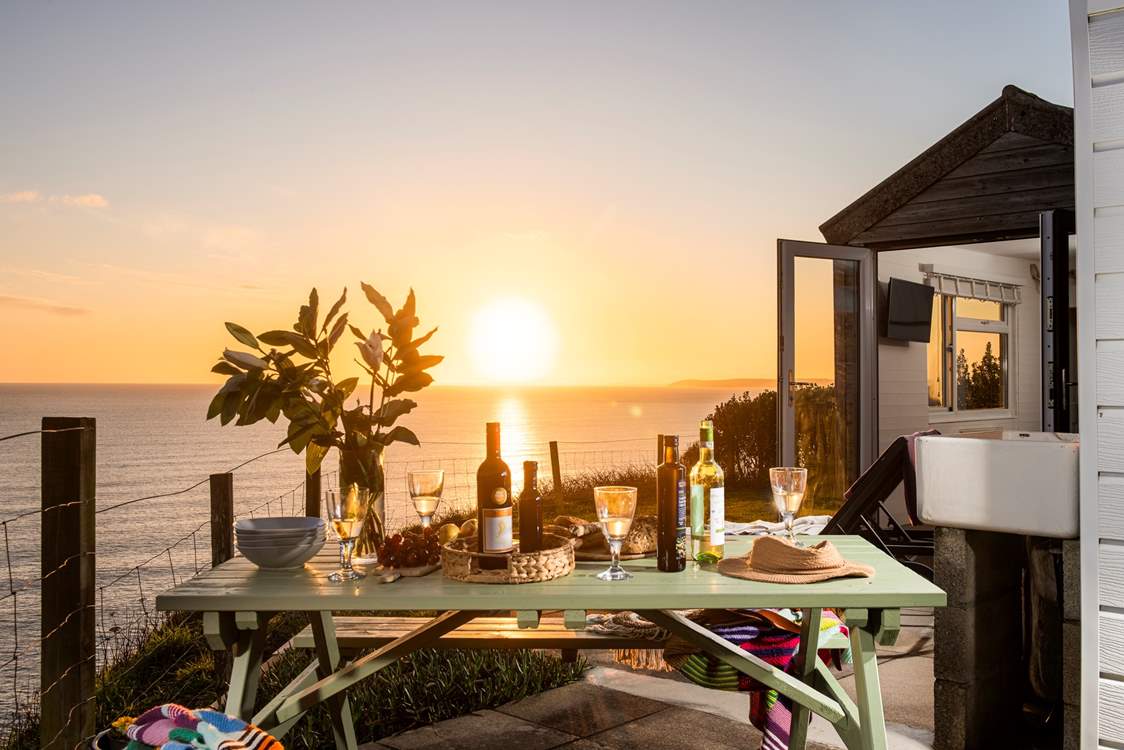Enjoy meals in the great outdoors as the sun sets at the end of the day.