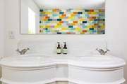 With twin wash-basins.