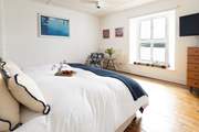 Bedroom 2 on the second floor has blissful views of the sea.