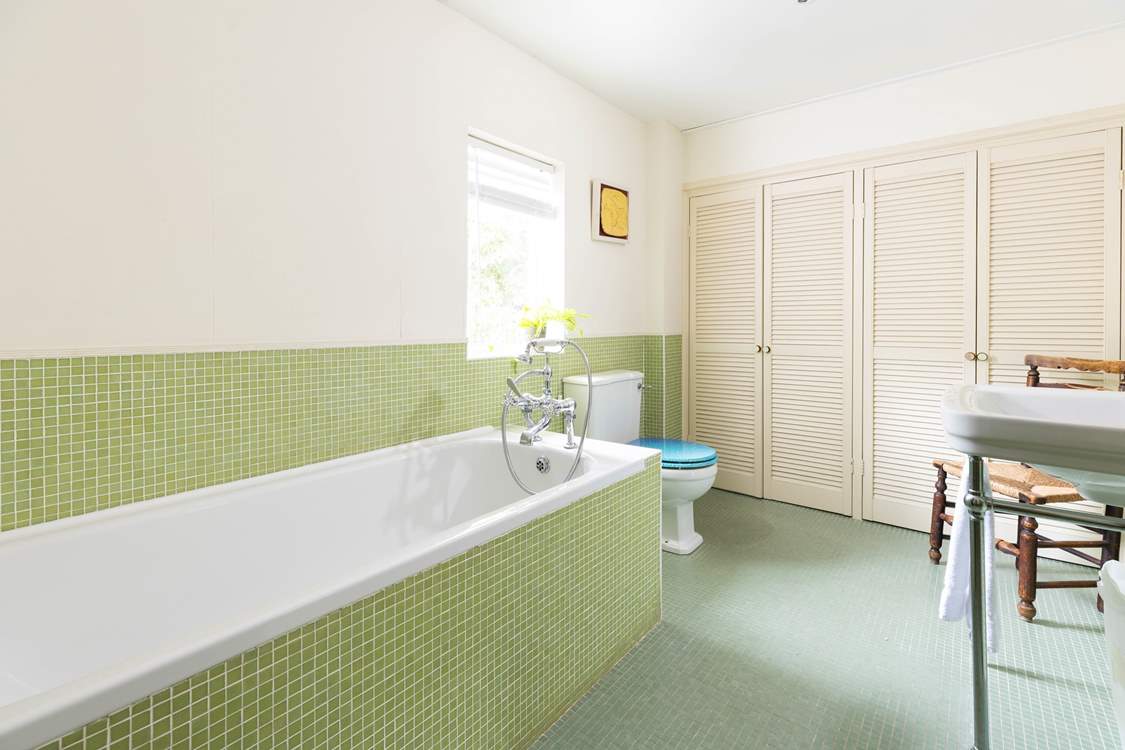 The spacious en suite bathroom with hand shower attachment.