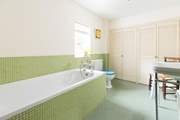 The spacious en suite bathroom with hand shower attachment.