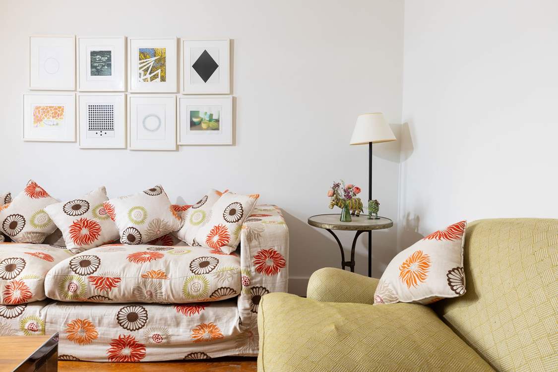 The cosy sitting-room has seating for everyone.