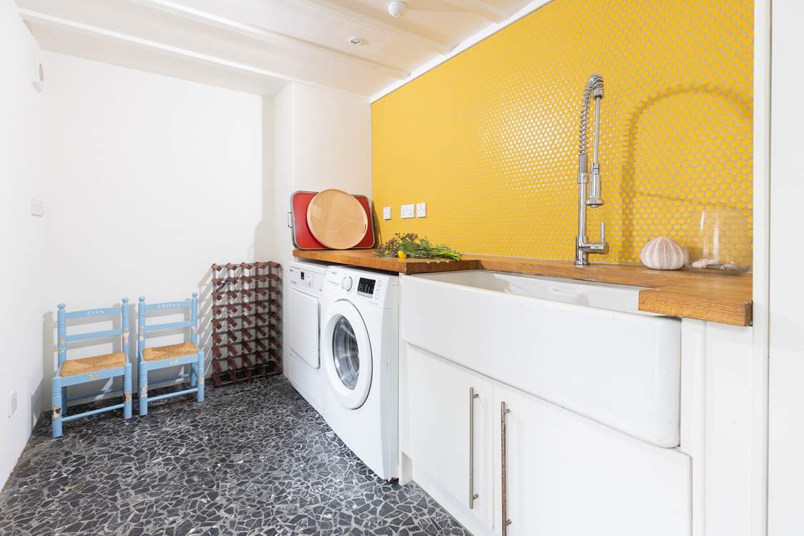 The handy utility-room has a washing machine and tumble-drier.