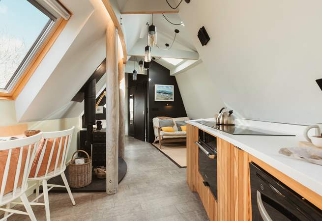 The open plan living space allows for the natural light to stream through.