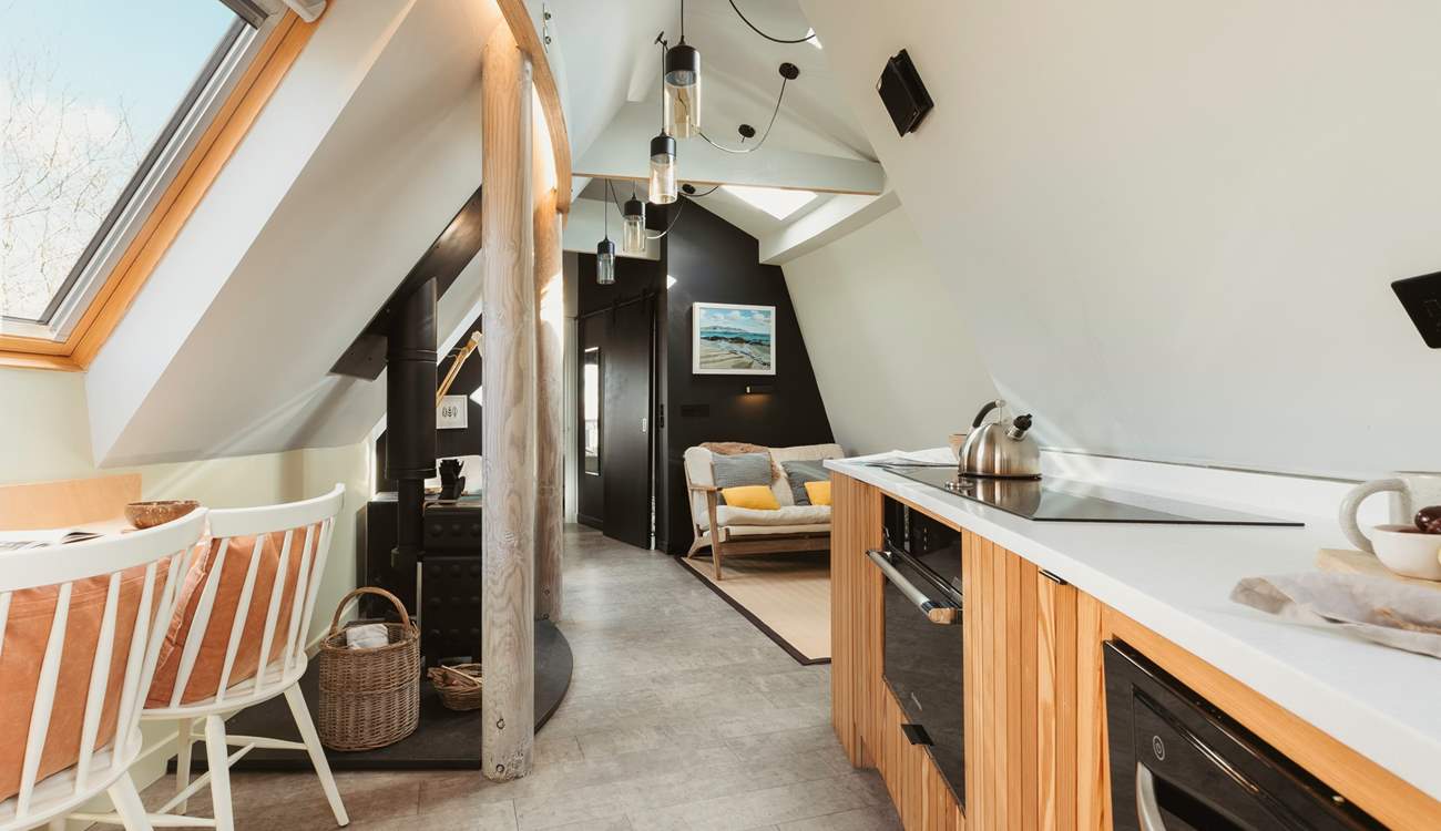 The open plan living space allows for the natural light to stream through.