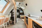 The open plan living space allows for the natural light to stream through.