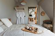 The king-size bed complete with Piglet in Bed bedding pairs perfectly for a restful night's sleep.