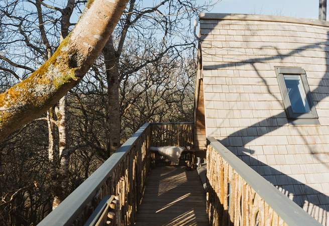 Step out of your treetop abode and follow the carefully hand crafted bridge to your outdoor space.