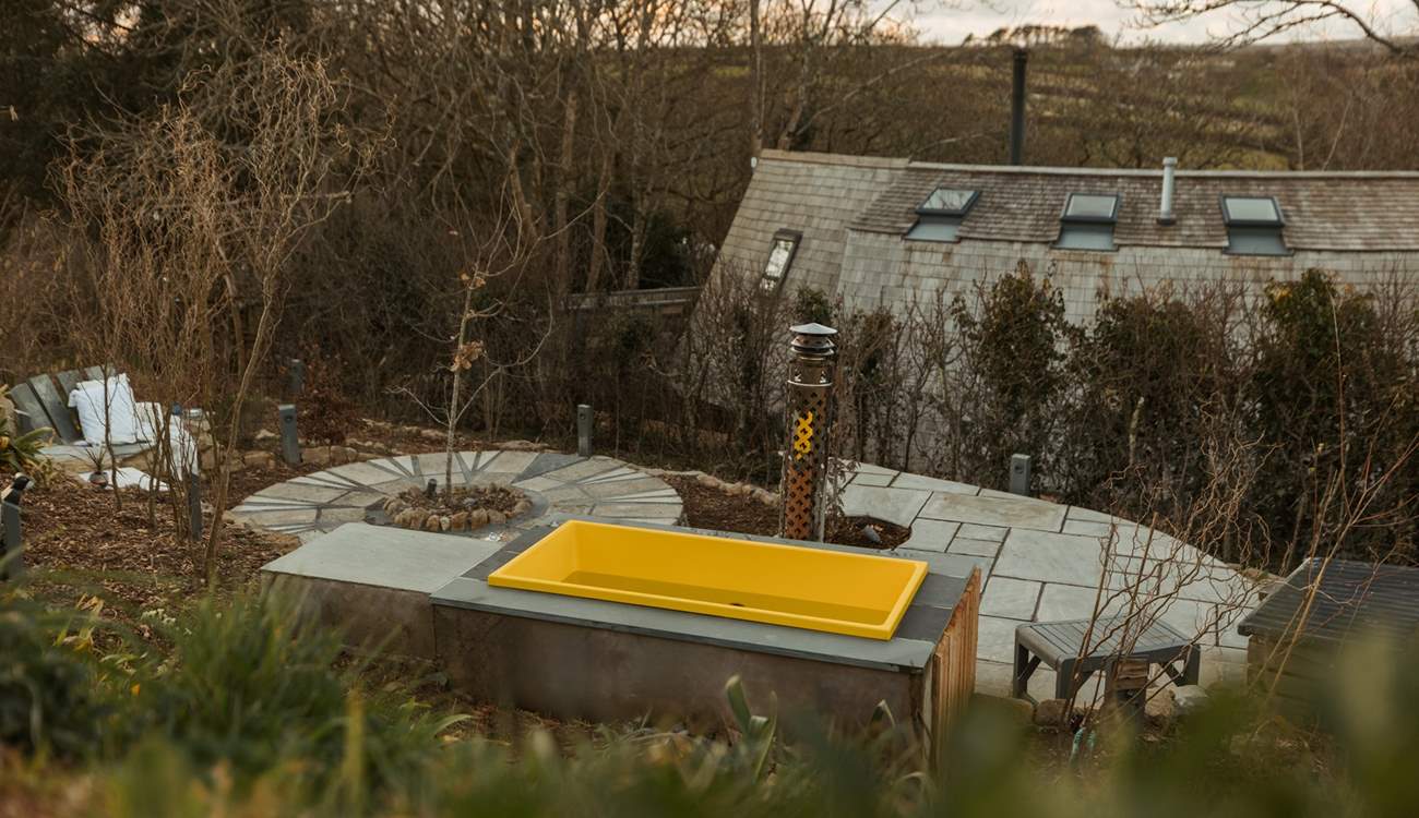 Enjoy a soak in the wood-fired outdoor bath.