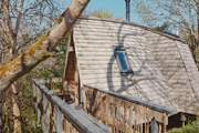 Step out of your treetop abode and follow the carefully hand crafted bridge to your outdoor space.
