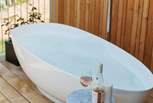 Sink into the soul-soothing depths of the outdoor stone bath.