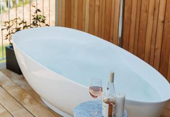 Sink into the soul-soothing depths of the outdoor stone bath.