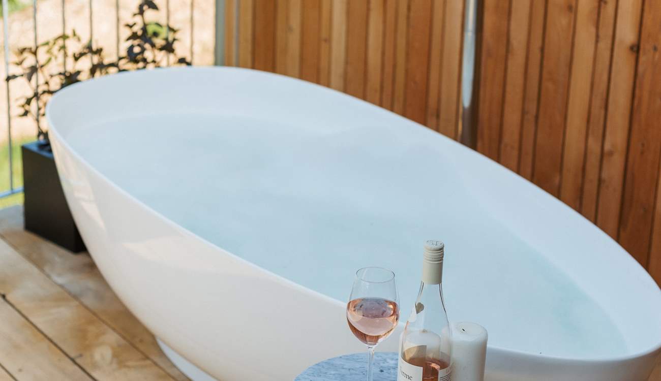 Sink into the soul-soothing depths of the outdoor stone bath.