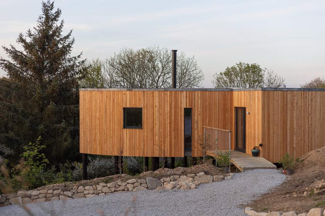 Step out of your larch-clad hideaway and venture up the hill to the shared picnic meadow.