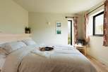 The king-size bed complete with Piglet in Bed bedding pairs perfectly for a restful night's sleep.
