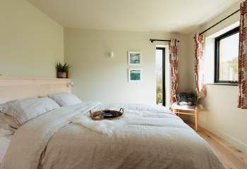 The king-size bed complete with Piglet in Bed bedding pairs perfectly for a restful night's sleep.