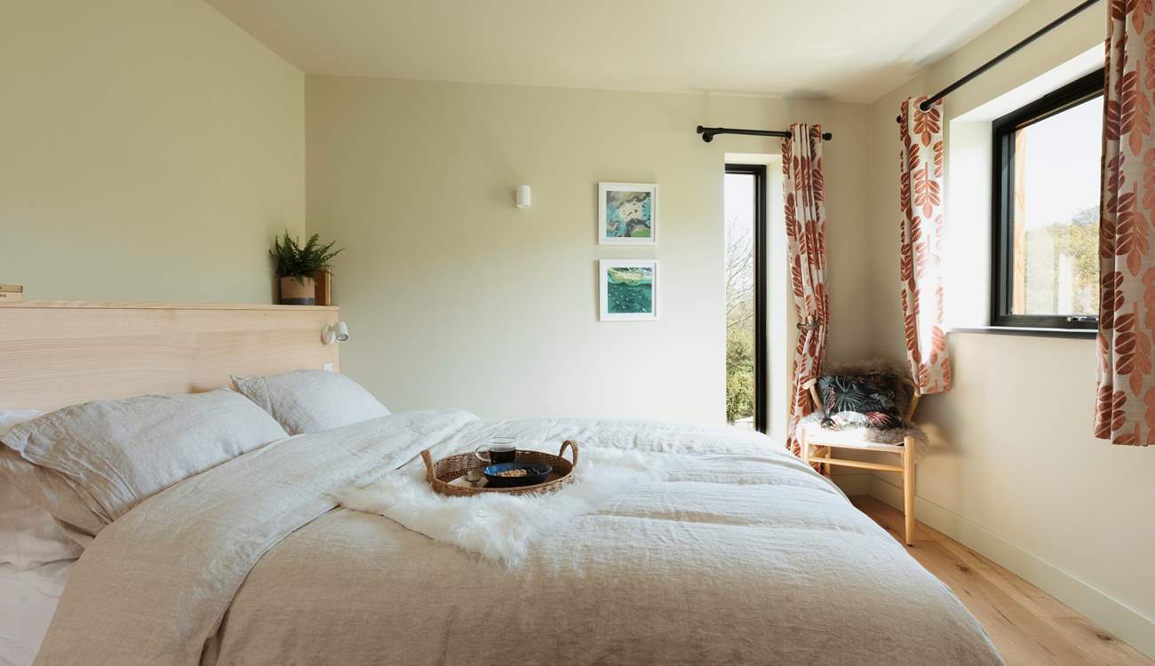 The king-size bed complete with Piglet in Bed bedding pairs perfectly for a restful night's sleep.