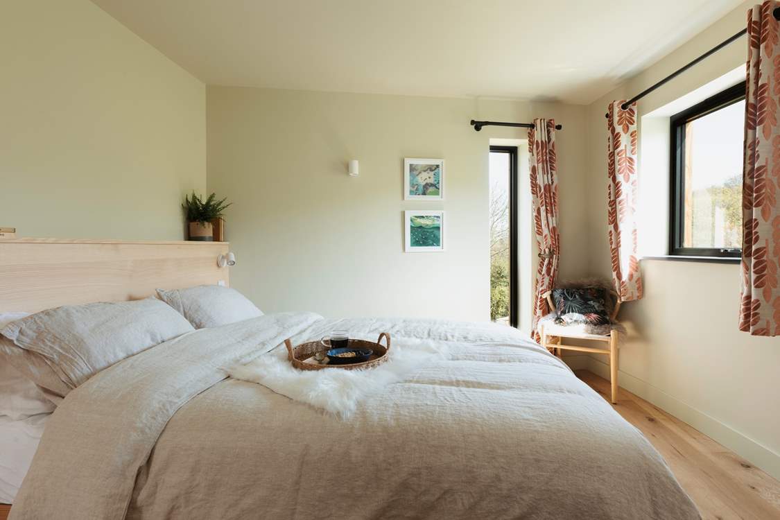The king-size bed complete with Piglet in Bed bedding pairs perfectly for a restful night's sleep.