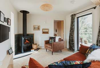 Spend evenings gathered around the stylish Jøtul wood burner.