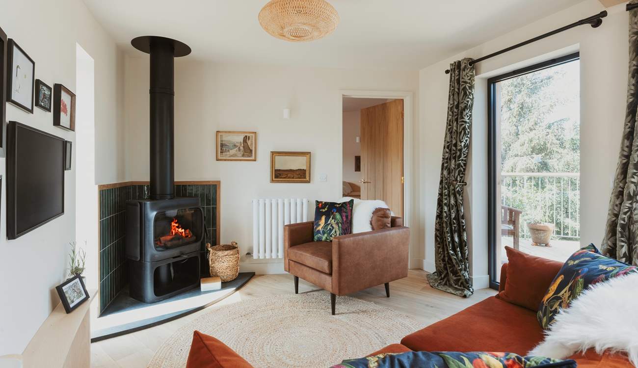 Spend evenings gathered around the stylish Jøtul wood burner.