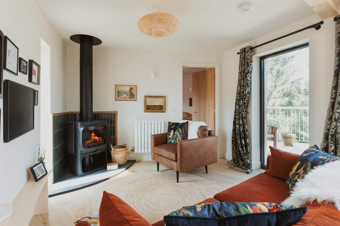 Spend evenings gathered around the stylish Jøtul wood burner.