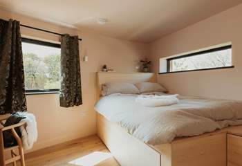 The second bedroom is also complete with luxury linens and a king-size bed.