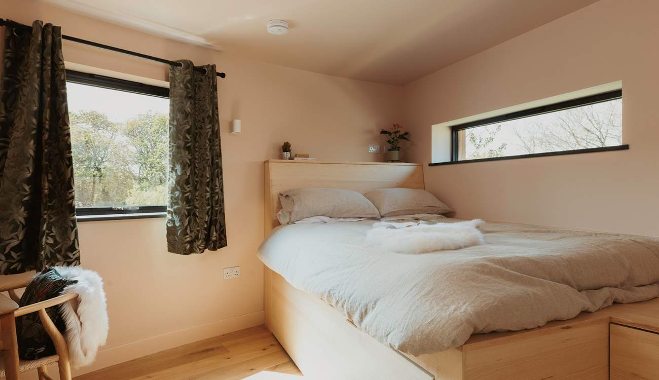 The second bedroom is also complete with luxury linens and a king-size bed.