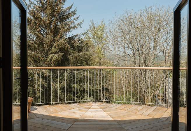 Step out onto your private deck with panoramic views across the canopy.