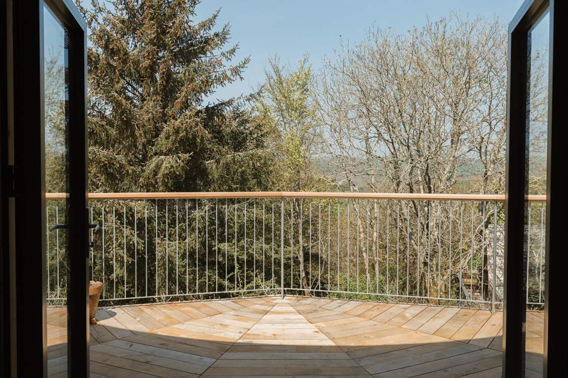 Step out onto your private deck with panoramic views across the canopy.