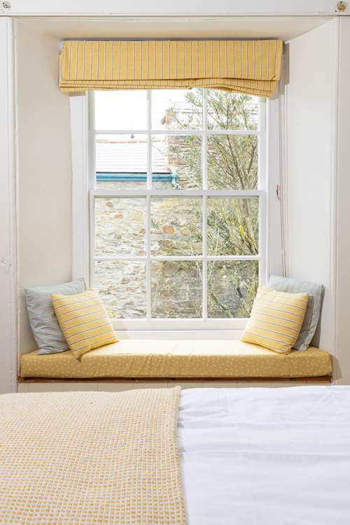 Window seat day dreaming in your perfect cottage escape.