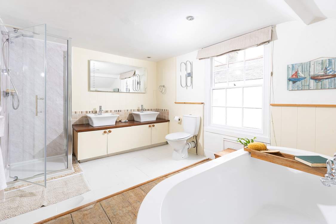 The twin basins and glow mirror give a luxury feel.