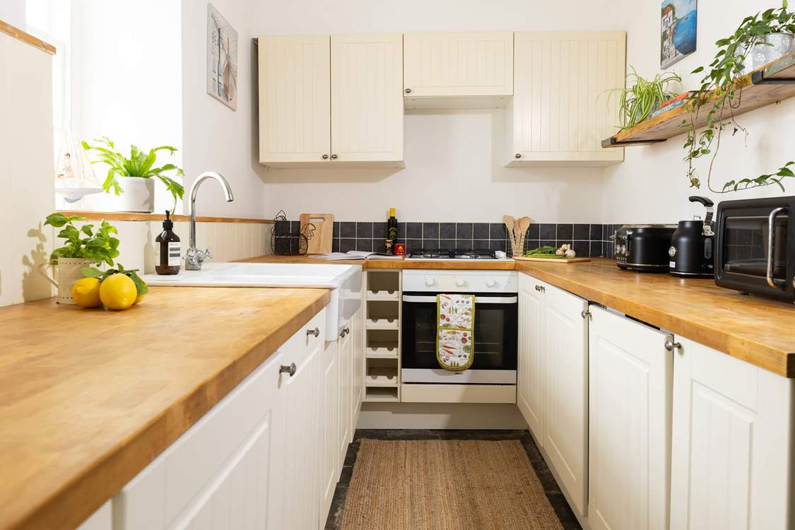 The kitchen is beautifully equipped with a Belfast sink.