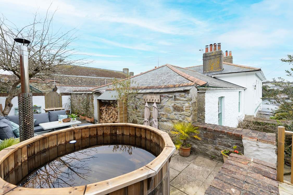 You can glimpse the river from the hot tub.