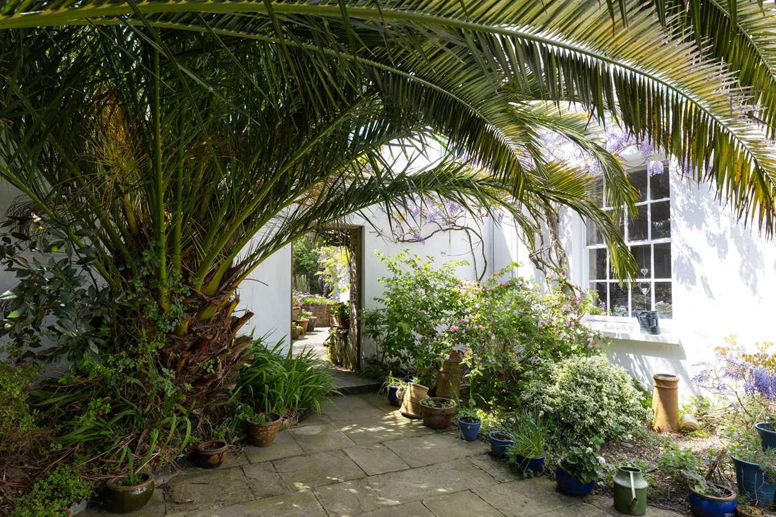 Passing the owners house you find Wisteria Cottage.