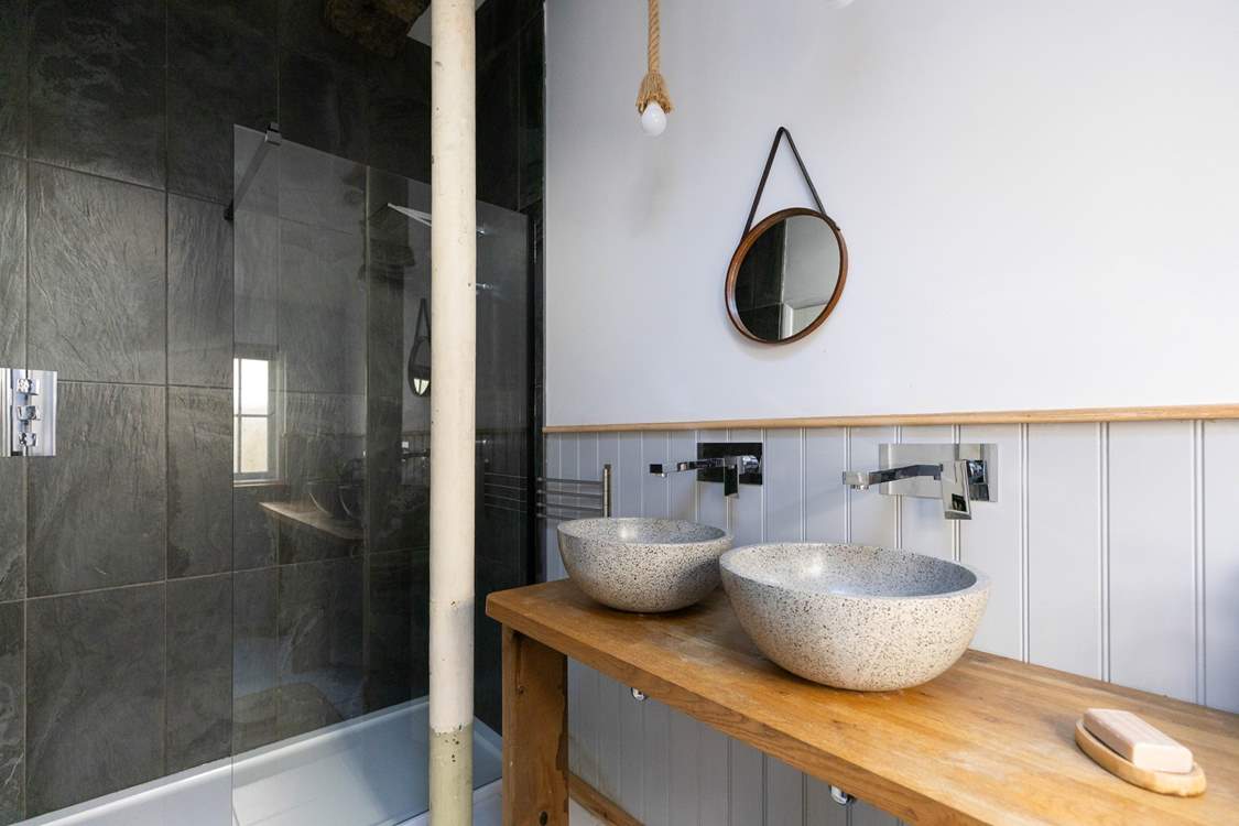 The family shower-room has high ceilings and double sinks.