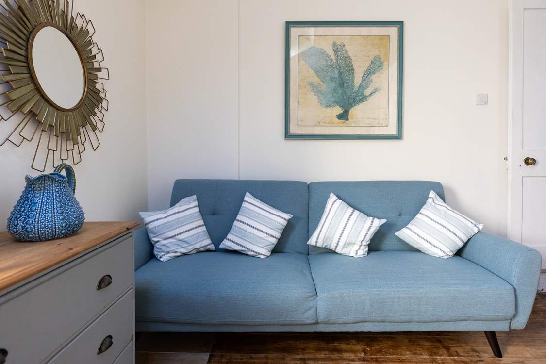 Enjoy a moment of peace and quiet on the sofa in the third bedroom.