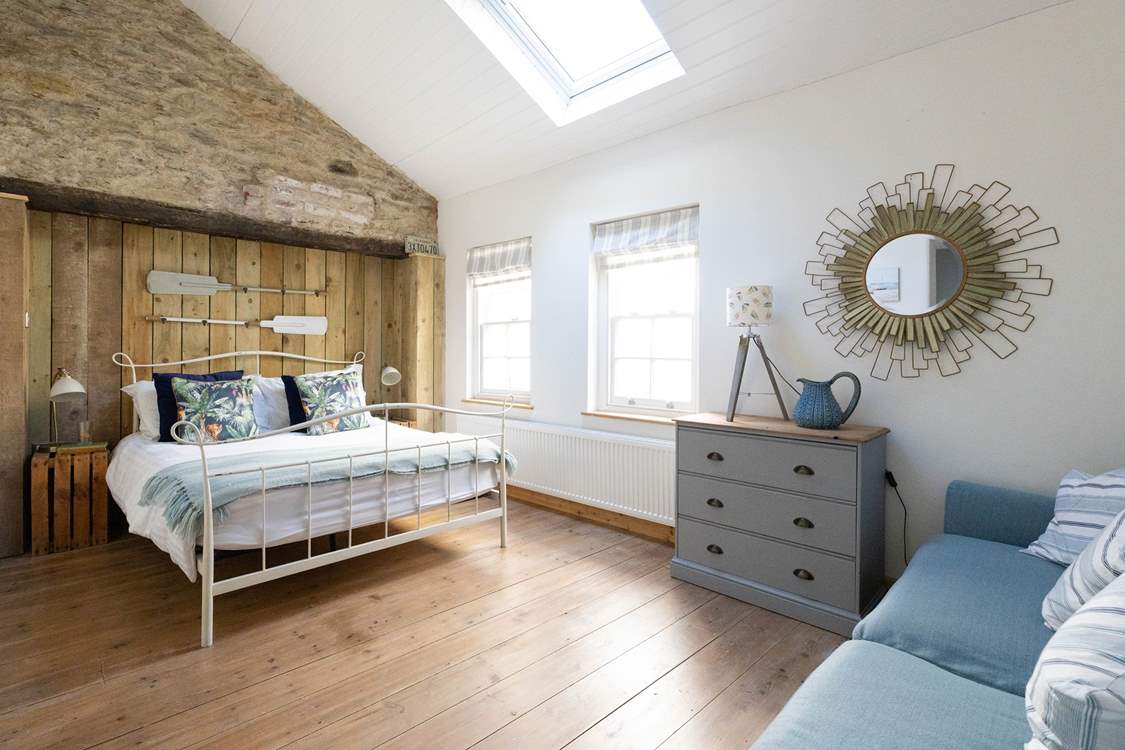 Two steps lead down to the double bedroom - such a lovely space.