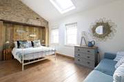Two steps lead down to the double bedroom - such a lovely space.