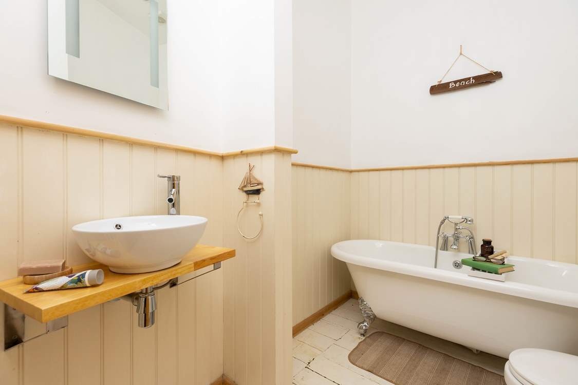 The family bathroom has a fabulous roll-top bath.