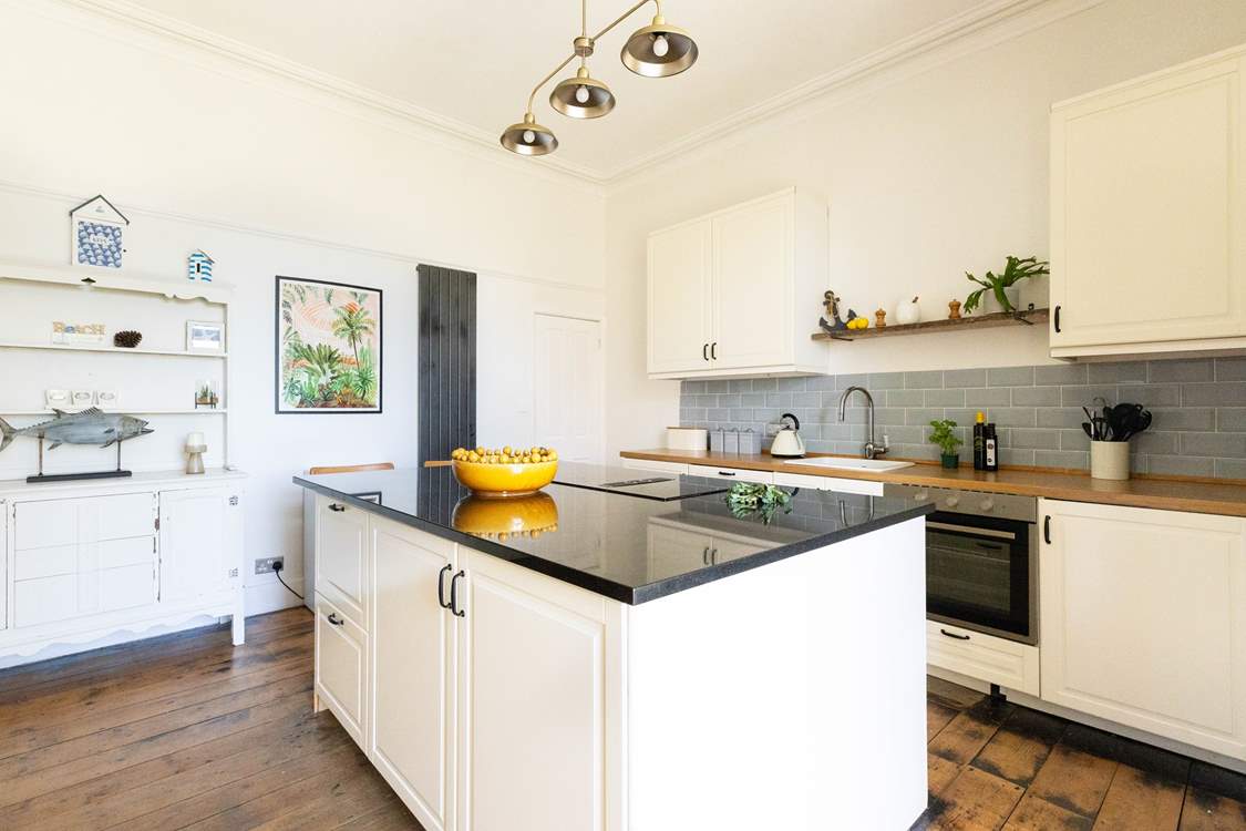 The kitchen/diner has a large island, perfect for preparing all your yummy food.