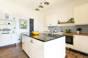 The kitchen/diner has a large island, perfect for preparing all your yummy food.
