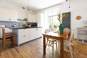 The kitchen leads to the garden and terrace, please take care on the large step down from the door.