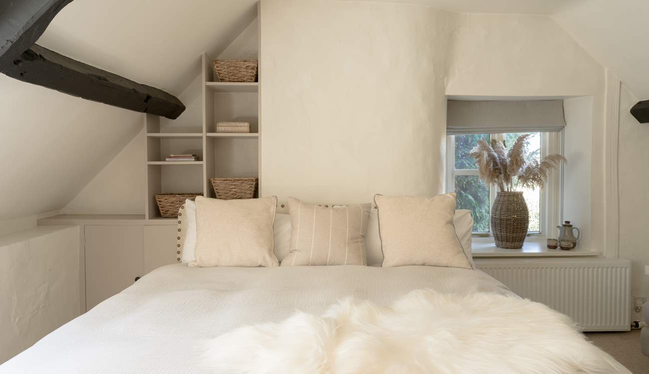 Bedroom 2 beckons you to snuggle up and dream, but please watch the beam! 