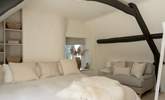 Curl up with a book in the large armchair.  - Thumbnail Image